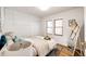 Comfortable bedroom featuring neutral decor, closet storage and natural light at 2039 S Sherman St, Denver, CO 80210