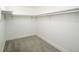 View of empty walk-in closet with neutral carpet and white shelving and closet rod at 2039 S Sherman St, Denver, CO 80210