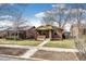 Quaint brick home on tree-lined street with a sidewalk; cozy, well-maintained property at 2039 S Sherman St, Denver, CO 80210