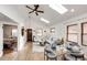 Stylish living room featuring a vaulted ceiling, skylights, and a modern dining area at 2039 S Sherman St, Denver, CO 80210