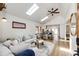 Bright open-concept living room with vaulted ceiling, skylights, and hardwood floors at 2039 S Sherman St, Denver, CO 80210