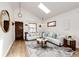 Cozy living room with hardwood floors, a designer rug, and plenty of natural light at 2039 S Sherman St, Denver, CO 80210