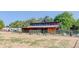 Animal shelter with green fencing and separate stalls at 9852 Zephyr Dr, Broomfield, CO 80021