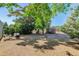 Large backyard with firepit, shed, and mature trees at 9852 Zephyr Dr, Broomfield, CO 80021