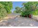 Spacious backyard area with seating, mature trees, and ample room for outdoor activities at 9852 Zephyr Dr, Broomfield, CO 80021