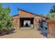 Rustic barn with large wooden doors, offering ample storage or workshop space at 9852 Zephyr Dr, Broomfield, CO 80021