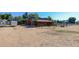Rustic barn with green metal fencing and a gravel area at 9852 Zephyr Dr, Broomfield, CO 80021