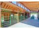 Well-lit barn interior with stalls, concrete floor, and open design at 9852 Zephyr Dr, Broomfield, CO 80021