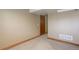 Neutral colored walls with carpet flooring in a spacious basement at 9852 Zephyr Dr, Broomfield, CO 80021