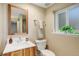 Basement bathroom with modern vanity and shower at 9852 Zephyr Dr, Broomfield, CO 80021