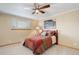 Comfortable bedroom with a large window, ceiling fan, and neutral decor at 9852 Zephyr Dr, Broomfield, CO 80021