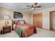 Bedroom with ceiling fan and wooden wardrobe at 9852 Zephyr Dr, Broomfield, CO 80021