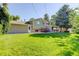 Ranch-style home with a large green lawn at 9852 Zephyr Dr, Broomfield, CO 80021