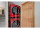 Basement laundry room with a stackable LG washer and dryer at 9852 Zephyr Dr, Broomfield, CO 80021
