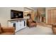 Cozy living room with television, stylish cabinet, and comfortable seating at 9852 Zephyr Dr, Broomfield, CO 80021