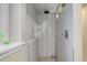 Updated shower with glass enclosure and pebble floor at 9852 Zephyr Dr, Broomfield, CO 80021