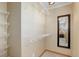 Walk-in closet with wire shelving and a full-length mirror at 9852 Zephyr Dr, Broomfield, CO 80021