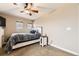 Comfortable bedroom with soft carpet, a ceiling fan, and an abundance of natural light at 9023 Apache Plume Dr # D, Parker, CO 80134