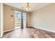 Bright dining area with sliding glass doors leading to an outdoor patio; neutral paint and tiled flooring at 9023 Apache Plume Dr # D, Parker, CO 80134
