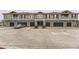 Spacious townhouse complex with multiple garages and ample parking space at 9023 Apache Plume Dr # D, Parker, CO 80134