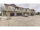 Attractive townhouse complex featuring attached garages and well-maintained exteriors at 9023 Apache Plume Dr # D, Parker, CO 80134