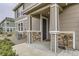 Charming front porch entrance with stone accents and covered entry at 9023 Apache Plume Dr # D, Parker, CO 80134
