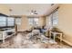 Comfortable living room featuring large windows, a sectional sofa, and tiled floors at 9023 Apache Plume Dr # D, Parker, CO 80134