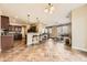 Open-concept living room featuring kitchen with breakfast bar and dining area at 9023 Apache Plume Dr # D, Parker, CO 80134