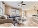 Inviting living room showcasing a ceiling fan and tile floors, perfect for relaxing and entertaining at 9023 Apache Plume Dr # D, Parker, CO 80134