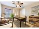 Bright home office with modern computer setup, stylish decor, and natural light at 9023 Apache Plume Dr # D, Parker, CO 80134