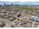 Aerial view of the city skyline, with residential neighborhoods and green spaces in the foreground at 3207 N Marion St, Denver, CO 80205