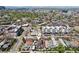 Aerial view of neighborhood with home marked, showcasing proximity to city amenities and green spaces at 3207 N Marion St, Denver, CO 80205