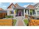 Charming home featuring a vibrant door, landscaped front yard, and inviting curb appeal at 3207 N Marion St, Denver, CO 80205