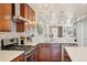 Well-equipped kitchen with stainless steel appliances, stone countertops, and ample cabinet space at 3207 N Marion St, Denver, CO 80205