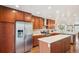 Spacious kitchen with stainless steel appliances, wooden cabinets and a large center island at 3207 N Marion St, Denver, CO 80205