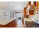 Gourmet kitchen with stainless steel appliances, modern countertops, and outdoor access at 3207 N Marion St, Denver, CO 80205