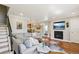 Spacious room features hardwood floors, fireplace, and an open layout leading to the dining area at 3207 N Marion St, Denver, CO 80205