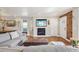 Comfortable living room area with fireplace, exposed brick, and hardwood floors at 3207 N Marion St, Denver, CO 80205