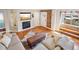 Cozy living room features a fireplace, exposed brick, and ample space for relaxation at 3207 N Marion St, Denver, CO 80205