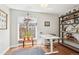 Cozy office space with hardwood floors, natural light and a modern standing desk at 3207 N Marion St, Denver, CO 80205