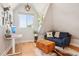 Inviting sitting area features a desk, a large window, and a comfortable sofa at 3207 N Marion St, Denver, CO 80205