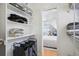 Bright walk-in closet with ample shelving and storage leading into a sunlit bedroom area at 3207 N Marion St, Denver, CO 80205