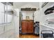 Well-organized walk-in closet featuring custom shelving, storage baskets, and a classic wooden dresser at 3207 N Marion St, Denver, CO 80205