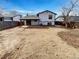 Spacious backyard with a covered patio, wood fence, and potential for landscaping at 16841 E Mansfield Cir, Aurora, CO 80013