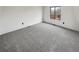 Bright bedroom with neutral carpet and a window overlooking the yard at 16841 E Mansfield Cir, Aurora, CO 80013