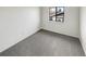 Bright bedroom with neutral carpeting and a window providing natural light at 16841 E Mansfield Cir, Aurora, CO 80013