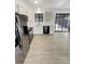 Modern kitchen features updated appliances, white cabinetry, and sliding glass doors to backyard at 16841 E Mansfield Cir, Aurora, CO 80013
