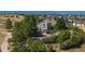 Aerial view of the house, storage shed, and lush landscaping at 8853 N Awl Rd, Parker, CO 80138