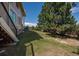 Lush backyard with a large tree and a glimpse of the home's exterior, showcasing a serene outdoor space at 8853 N Awl Rd, Parker, CO 80138