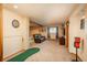 Spacious basement featuring a golf putting area, comfortable seating, and entertainment options at 8853 N Awl Rd, Parker, CO 80138